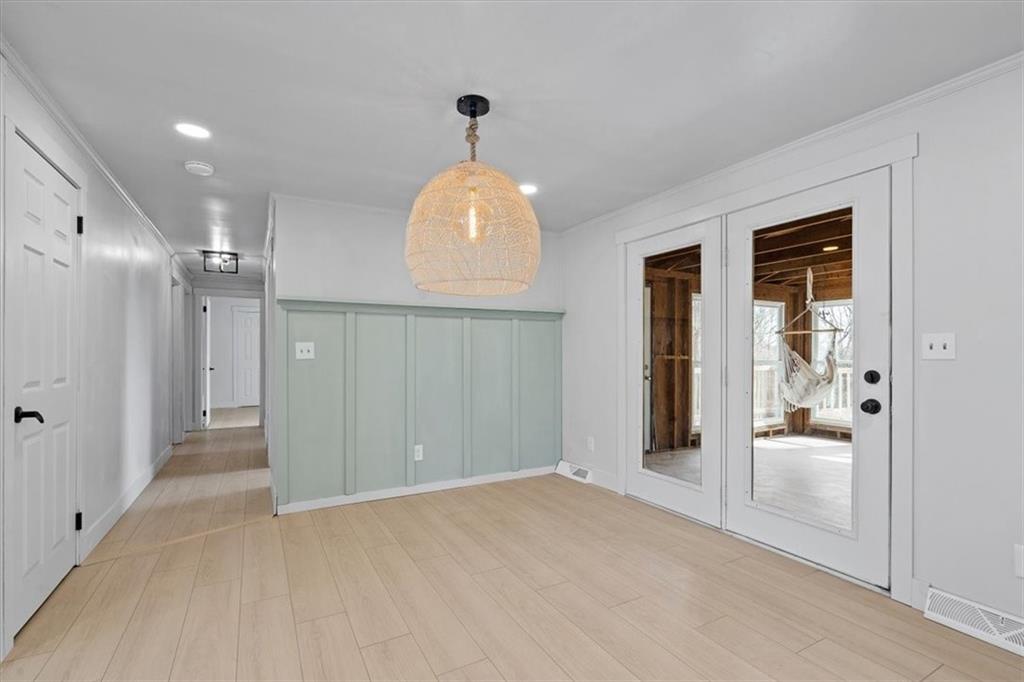 319 Gringo Independence Road Aliquippa, PA 15001 - Photo 10 of 25 a view of a hallway with a livingroom and a chandelier fan