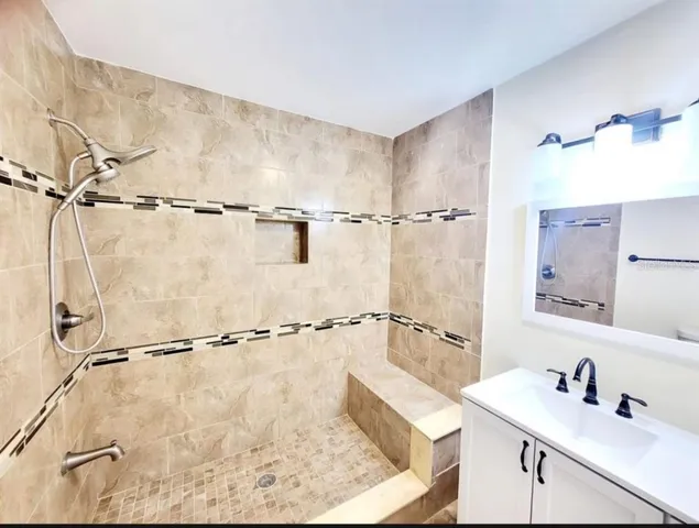 a bathroom with a sink and a mirror