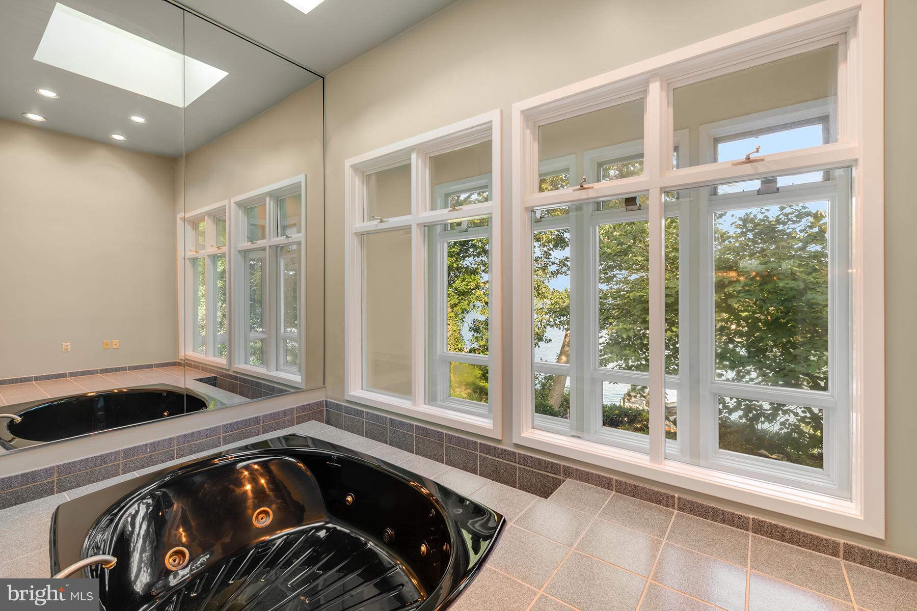 65 Slama Road Edgewater, MD 21037 - Photo 20 of 27 Jetted tub in master bath overlooks the water