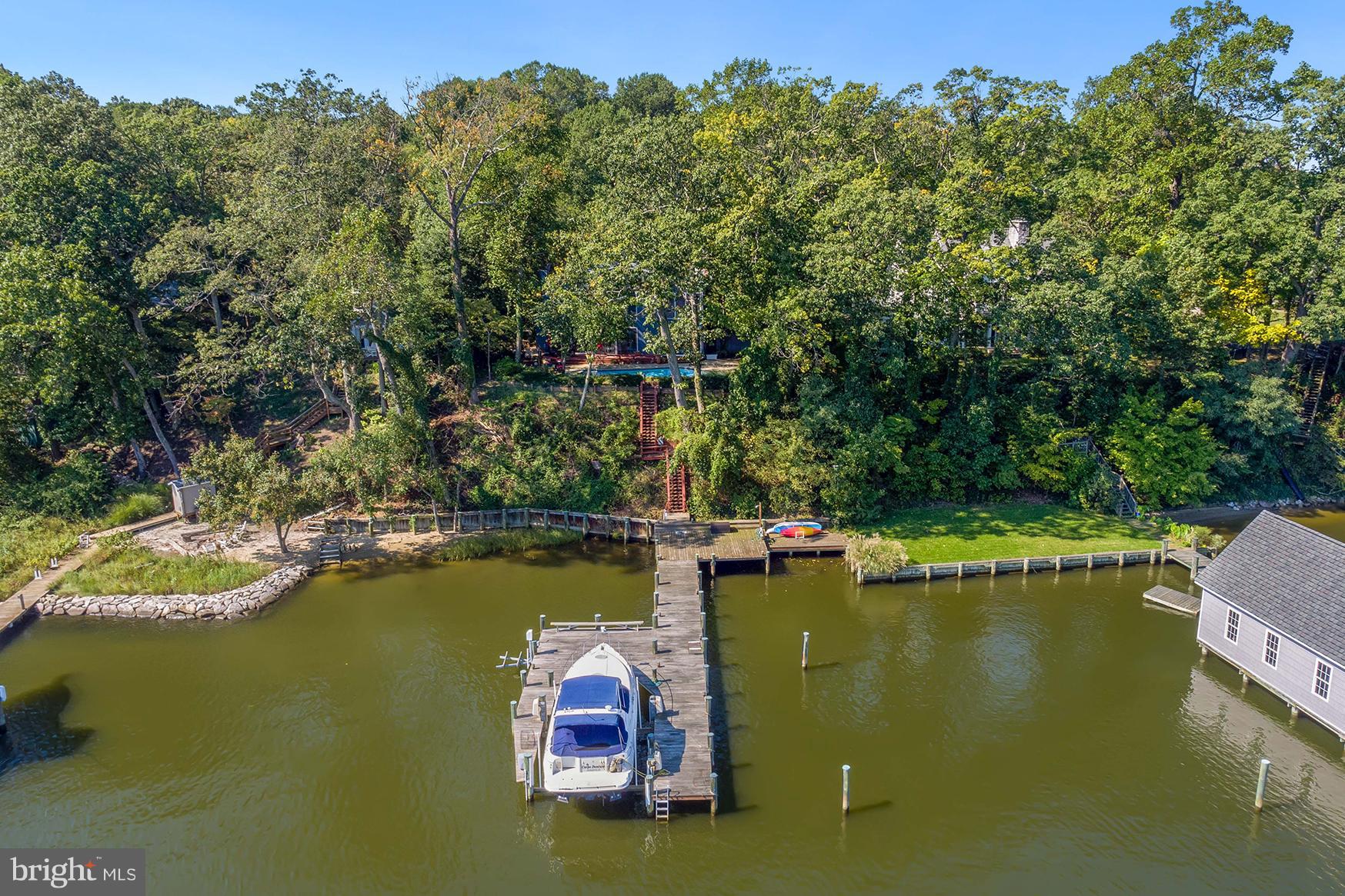 65 Slama Road Edgewater, MD 21037 - Photo 4 of 27 View of the house and pier from the South River
