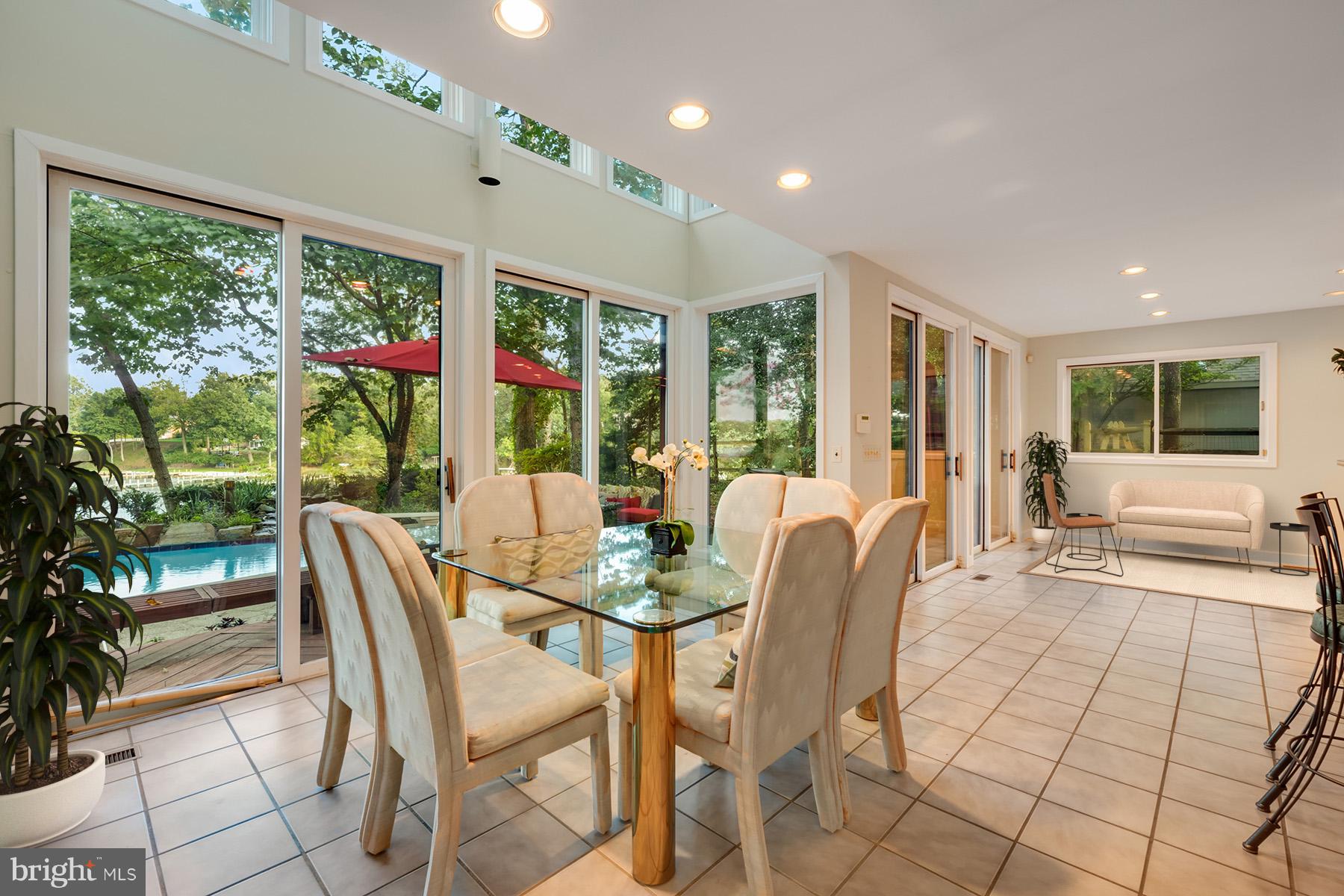 65 Slama Road Edgewater, MD 21037 - Photo 9 of 27 Sliding glass doors to the waterside patio