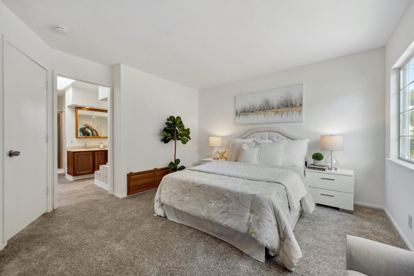 1060 Crespi Drive Pacifica, CA 94044 - Photo 15 of 32 a bedroom with a bed and a table