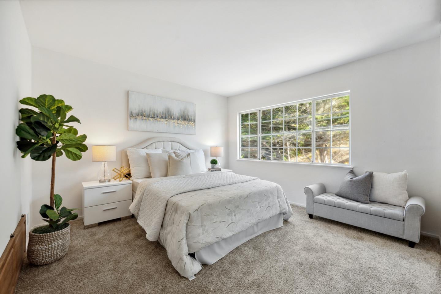 1060 Crespi Drive Pacifica, CA 94044 - Photo 16 of 32 a bedroom with a bed and a couch