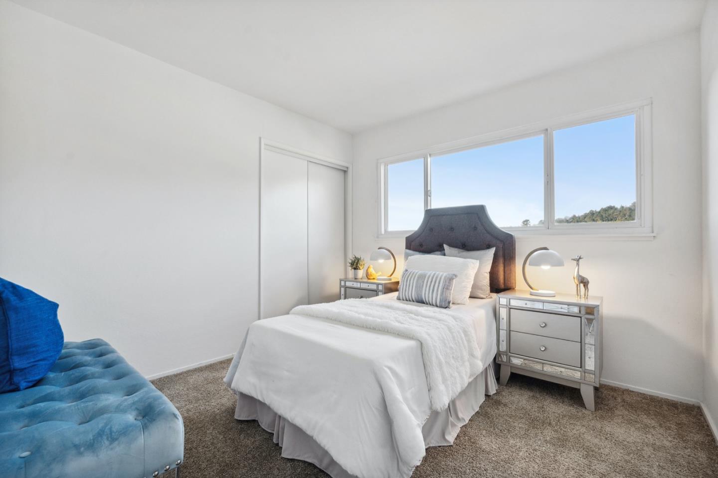 1060 Crespi Drive Pacifica, CA 94044 - Photo 20 of 32 a bedroom with a bed and window