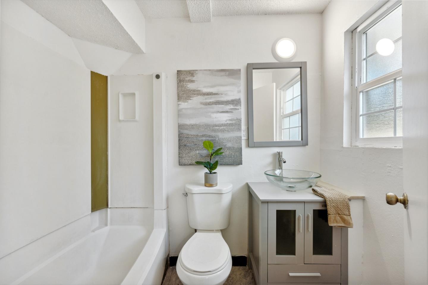 1060 Crespi Drive Pacifica, CA 94044 - Photo 25 of 32 a bathroom with a sink a toilet and shower