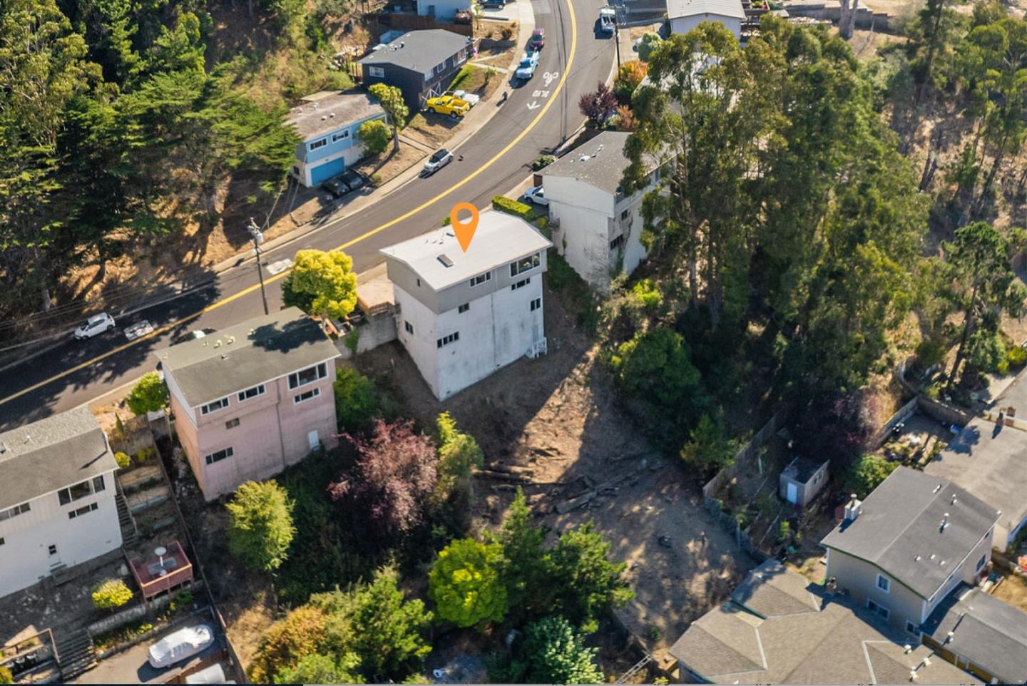 1060 Crespi Drive Pacifica, CA 94044 - Photo 4 of 32 an aerial view of a house with a yard and garden
