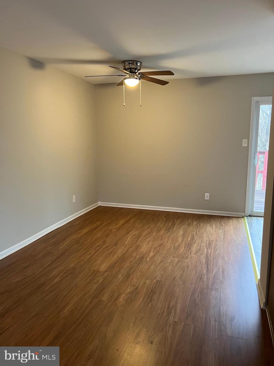 68 Hopewell Lane, Unit B Sicklerville, NJ 08081 - Photo 5 of 14 a view of a room with wooden floor and windows