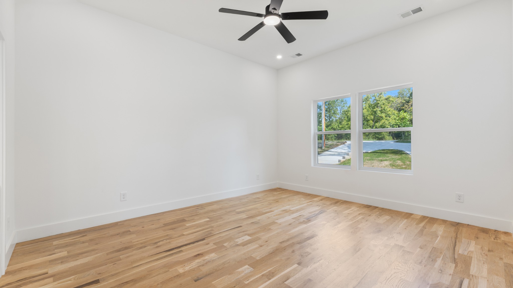 108 Devils Backbone Lane Manchester, TN 37355 - Photo 22 of 51 wooden floor in an empty room with a window