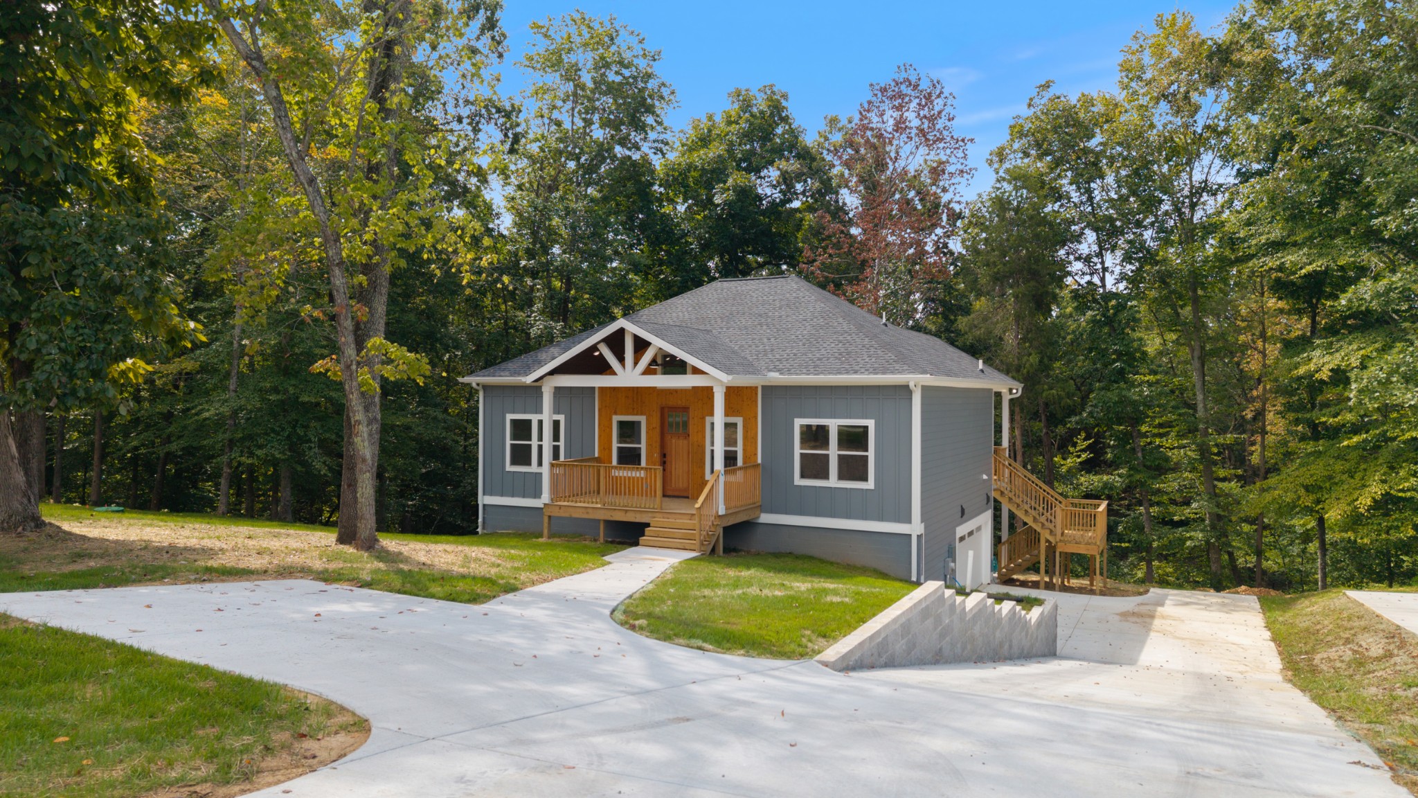 108 Devils Backbone Lane Manchester, TN 37355 - Photo 44 of 51 a front view of a house with a yard and garage