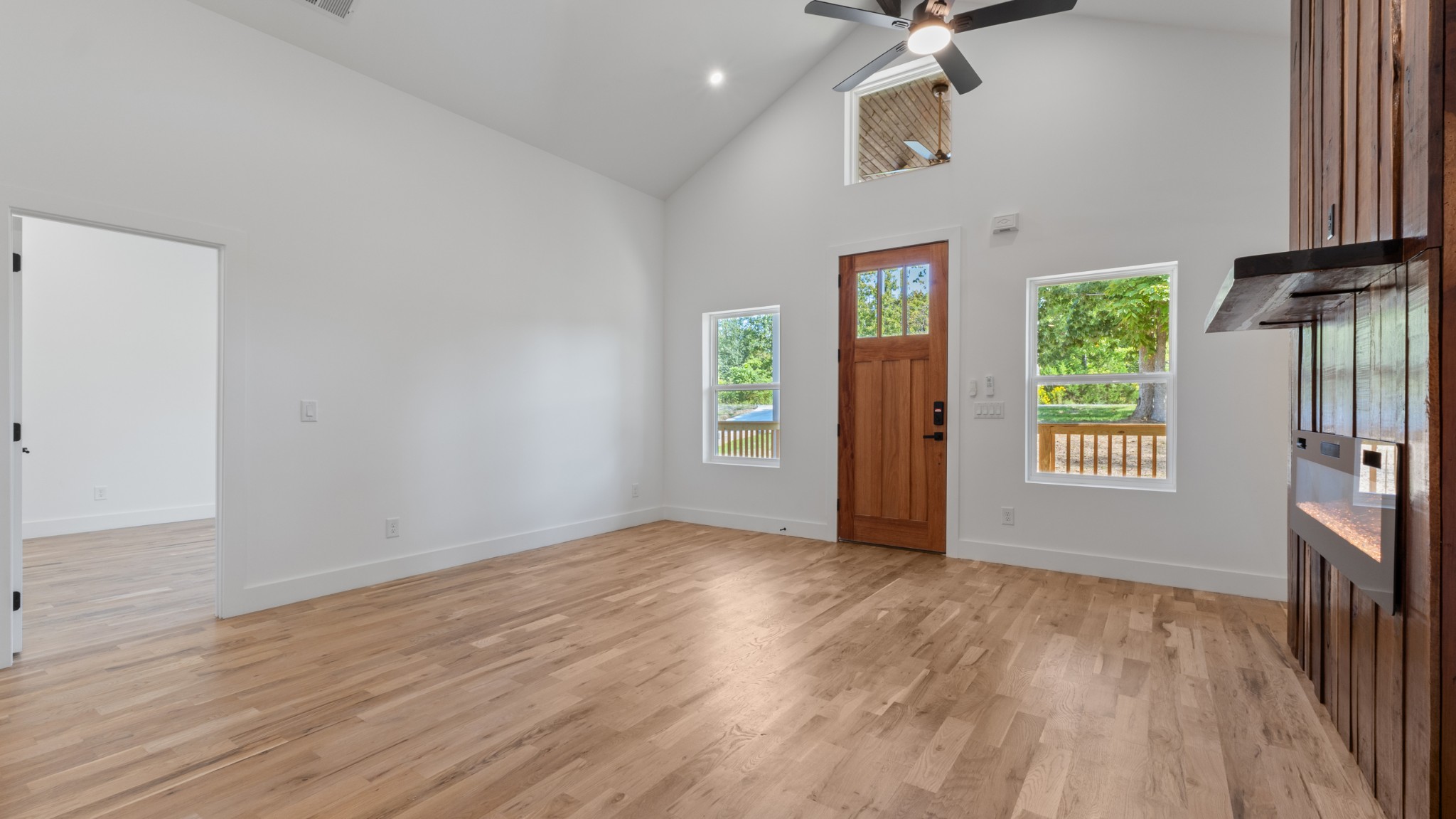 108 Devils Backbone Lane Manchester, TN 37355 - Photo 10 of 51 a view of an empty room with a window and wooden floor