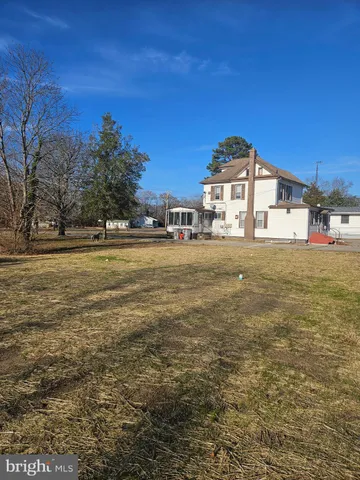 a view of a large body of water with a building in the background