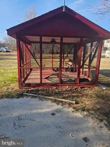 a view of a backyard with wooden fence