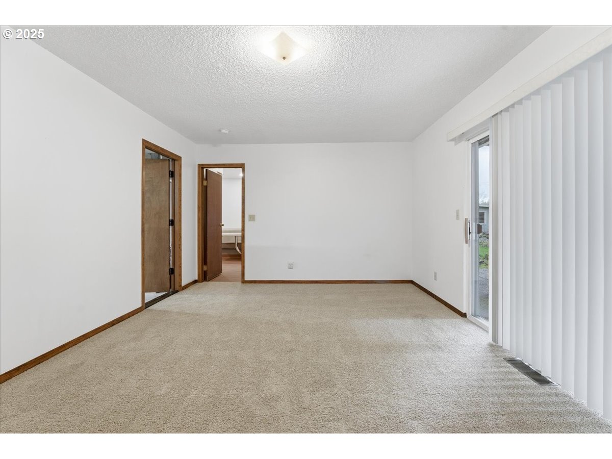 6760 Southwest 199th Court Beaverton, OR 97078 - Photo 17 of 44 a view of an empty room and closet area