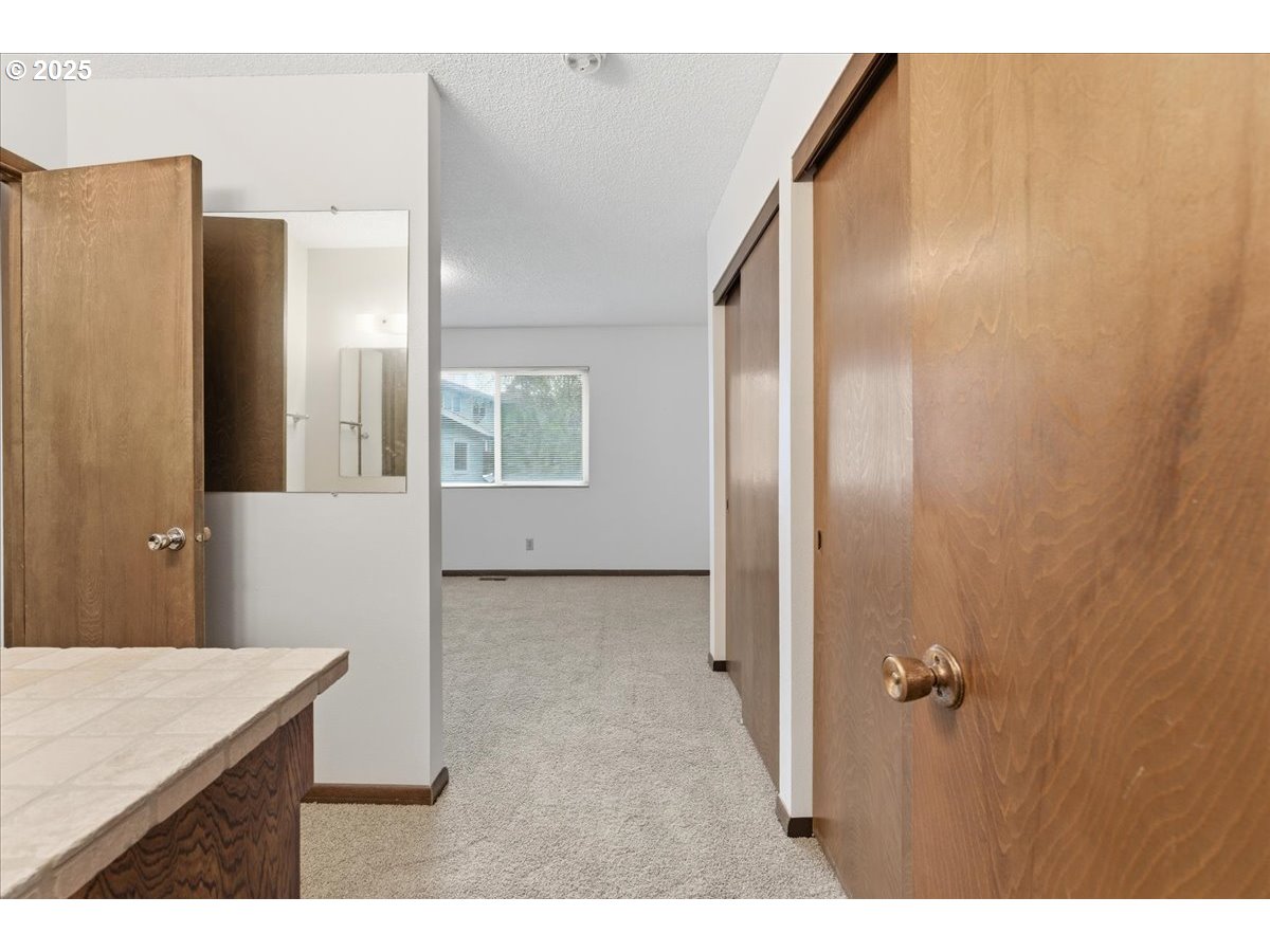 6760 Southwest 199th Court Beaverton, OR 97078 - Photo 18 of 44 a bathroom with a sink and mirror