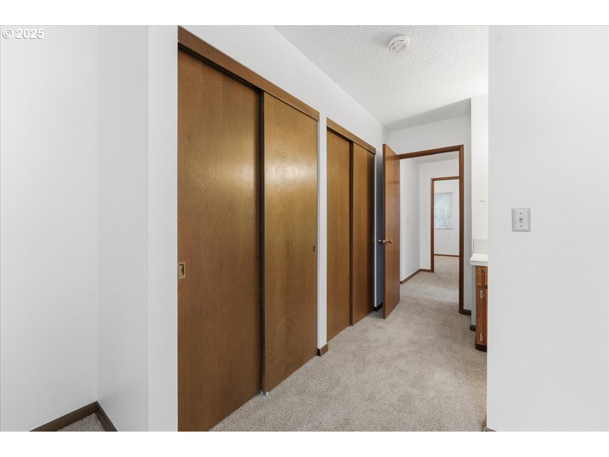 6760 Southwest 199th Court Beaverton, OR 97078 - Photo 24 of 44 a view of a hallway with closet area
