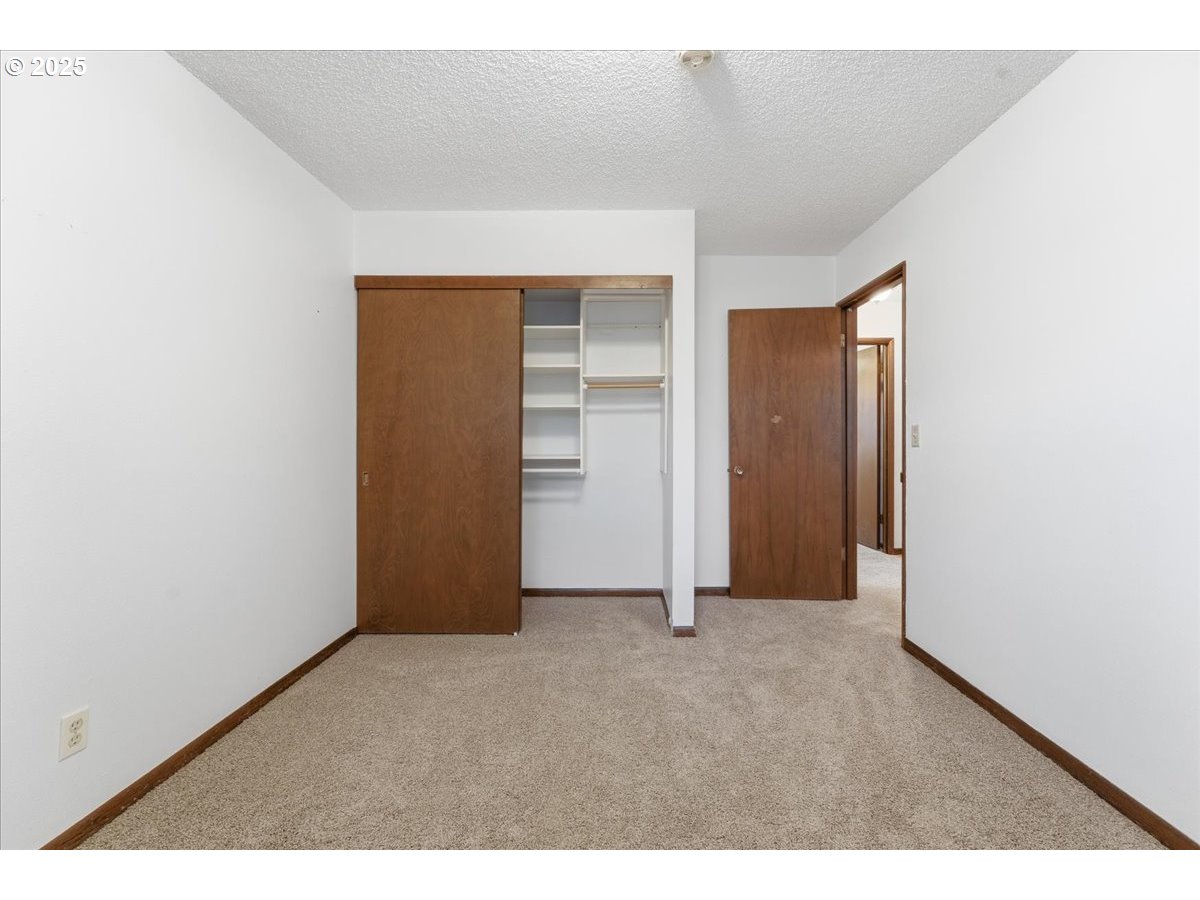6760 Southwest 199th Court Beaverton, OR 97078 - Photo 28 of 44 an empty room with closet