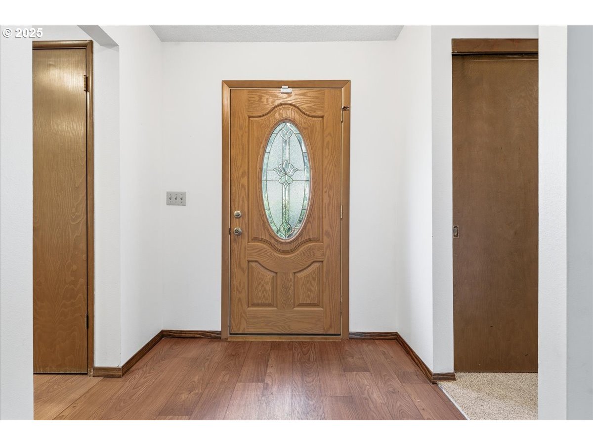 6760 Southwest 199th Court Beaverton, OR 97078 - Photo 3 of 44 a view of a door in a hallway