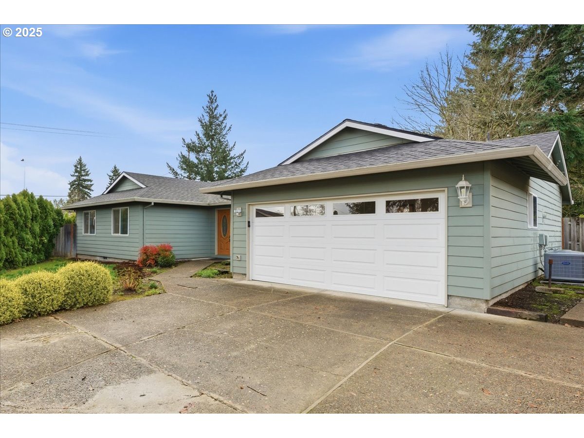 6760 Southwest 199th Court Beaverton, OR 97078 - Photo 42 of 44 a view of a house with a outdoor space and garage