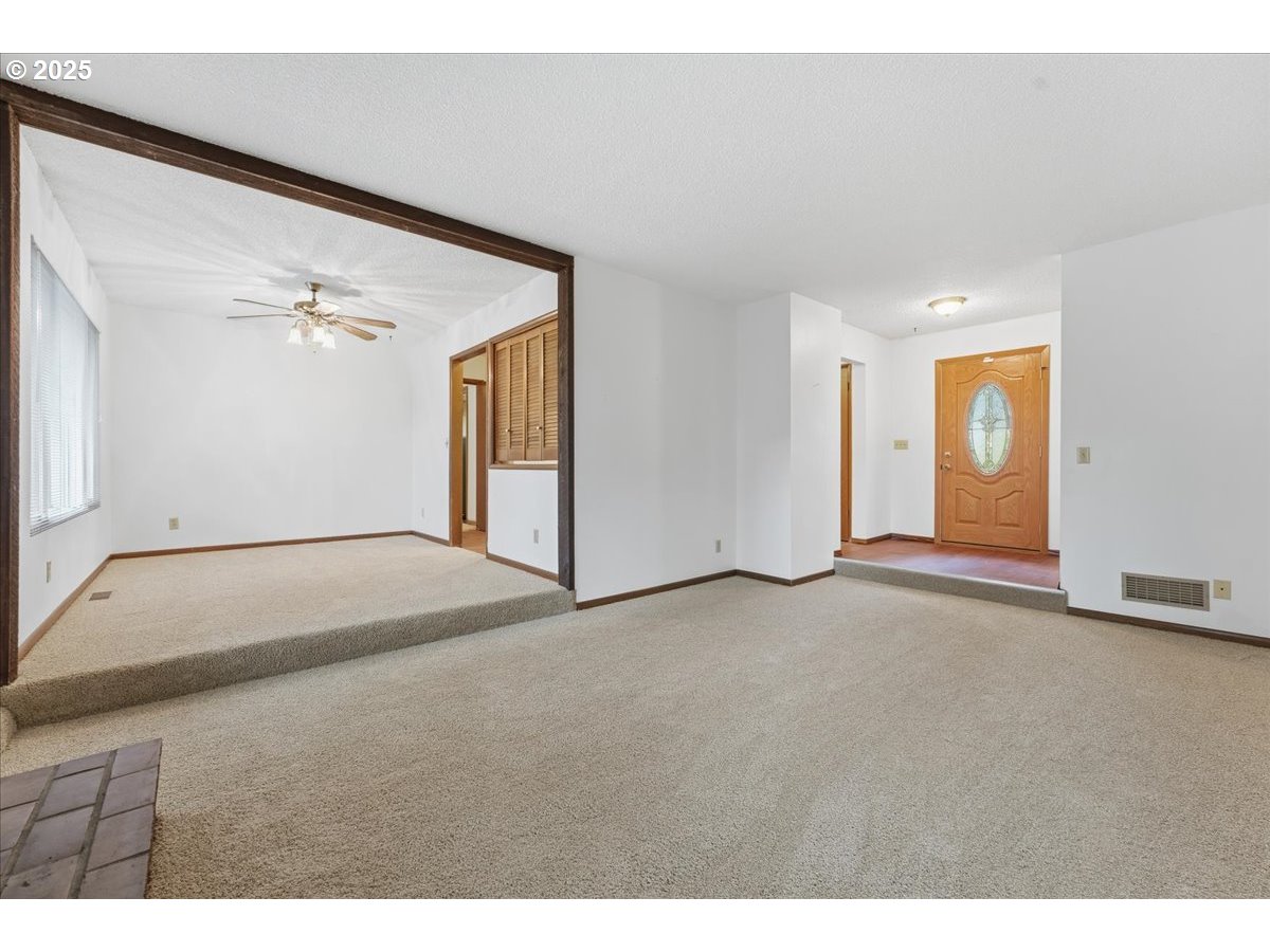 6760 Southwest 199th Court Beaverton, OR 97078 - Photo 6 of 44 a view of a big room with closet and windows