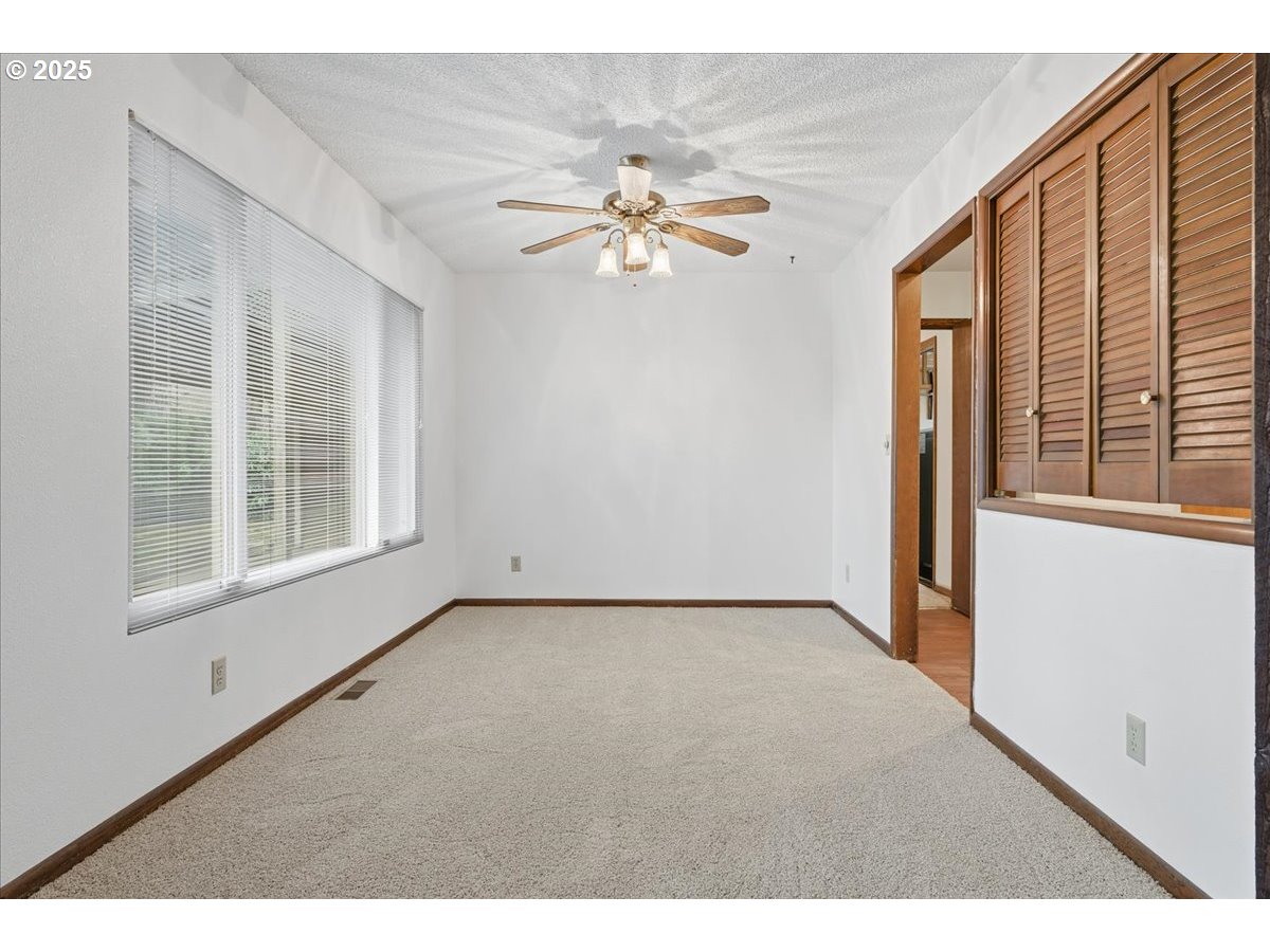 6760 Southwest 199th Court Beaverton, OR 97078 - Photo 7 of 44 a view of empty room with ceiling fan