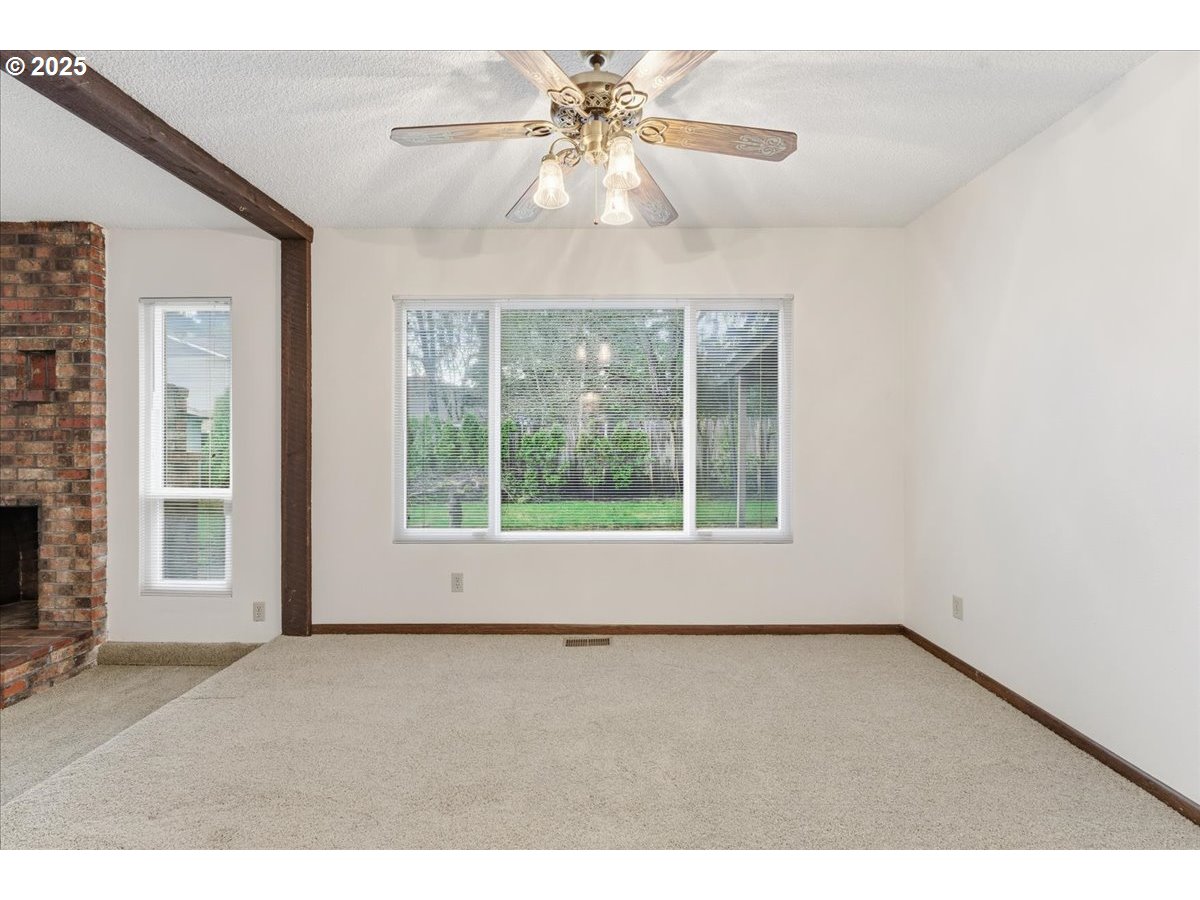 6760 Southwest 199th Court Beaverton, OR 97078 - Photo 8 of 44 a view of an empty room with a window