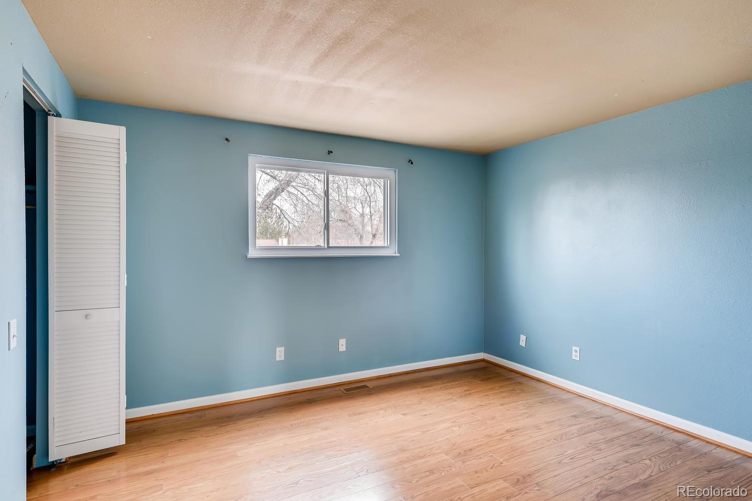 6734 Kendall Street Arvada, CO 80003 - Photo 15 of 36 an empty room with a window