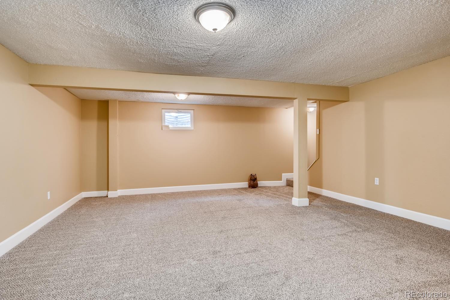 6734 Kendall Street Arvada, CO 80003 - Photo 20 of 36 an empty room with windows