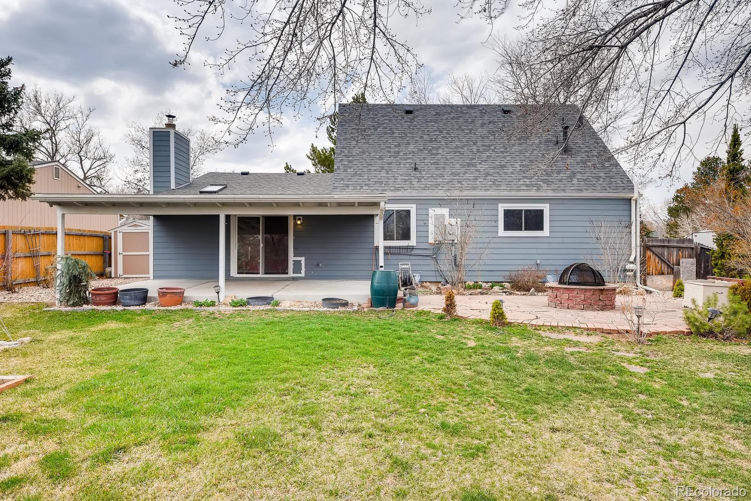 6734 Kendall Street Arvada, CO 80003 - Photo 26 of 36 a front view of house with yard