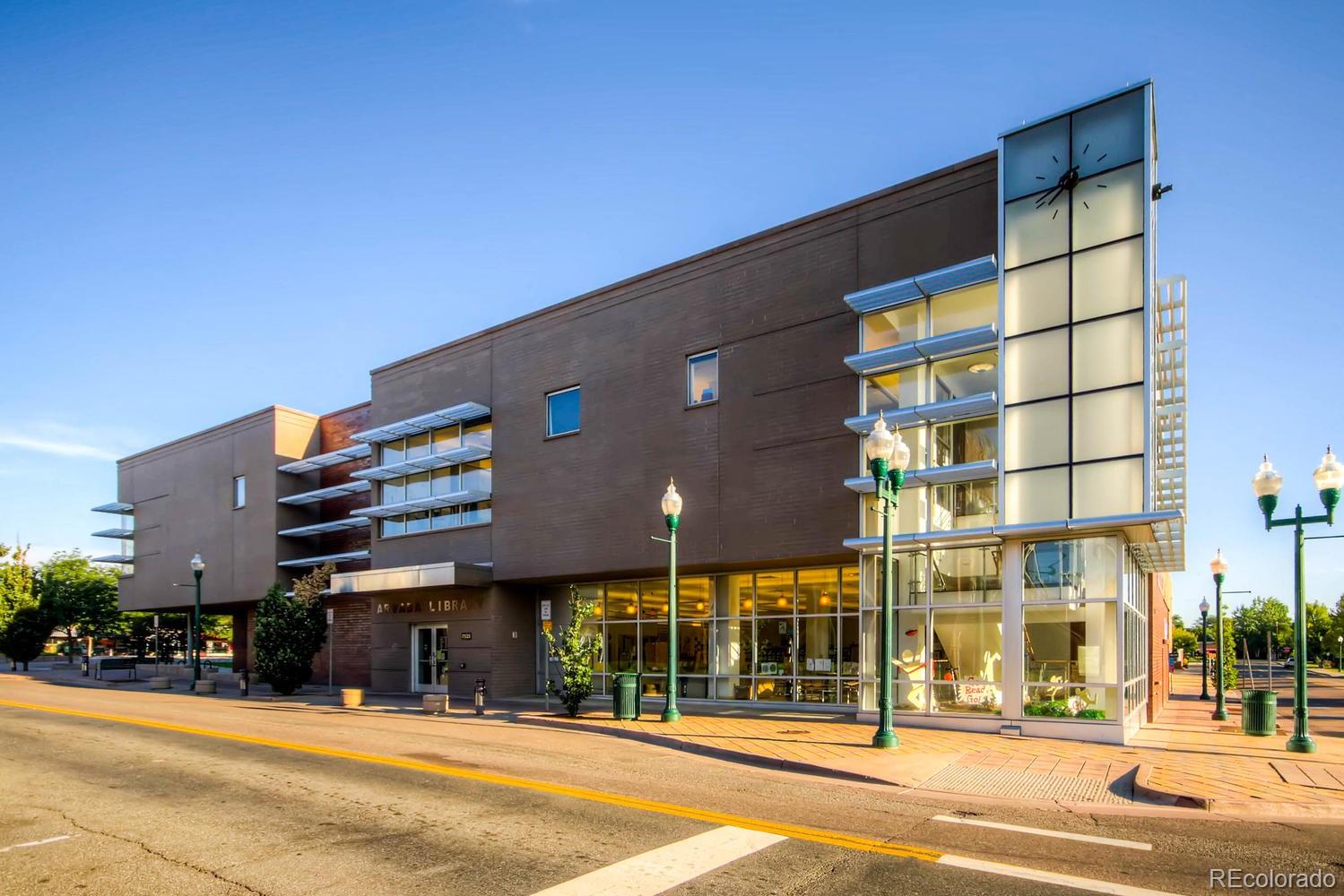 6734 Kendall Street Arvada, CO 80003 - Photo 27 of 36 a front view of a building with street
