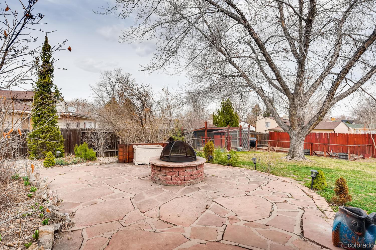 6734 Kendall Street Arvada, CO 80003 - Photo 6 of 36 a view of a park that has a tree on it