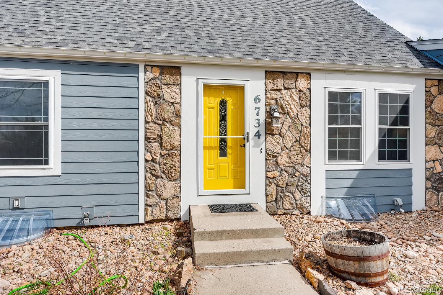 6734 Kendall Street Arvada, CO 80003 - Photo 8 of 36 a front view of a house with a window