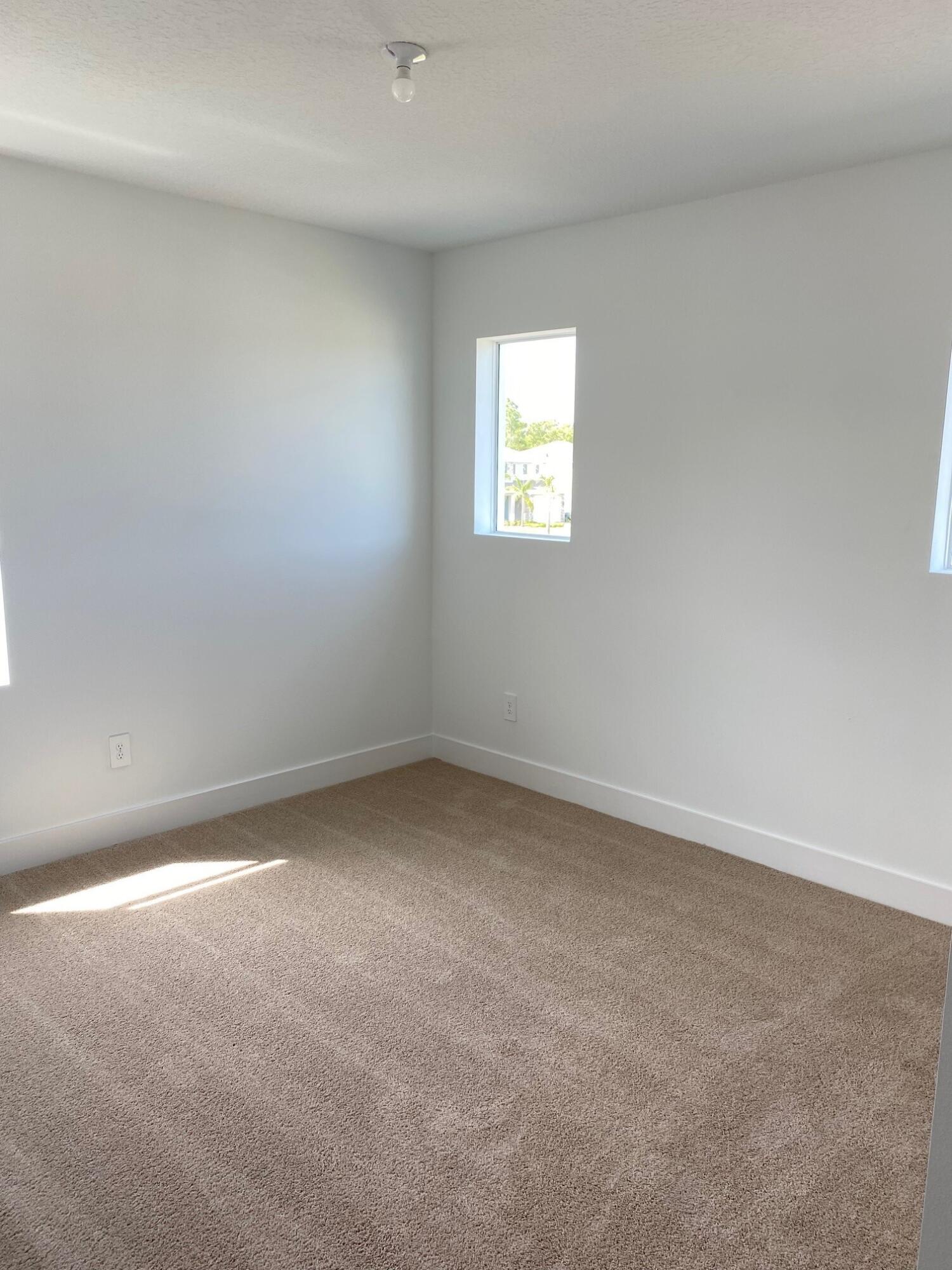 6830 Southeast Park Trace Drive Stuart, FL 34997 - Photo 12 of 20 a view of an empty room and a window