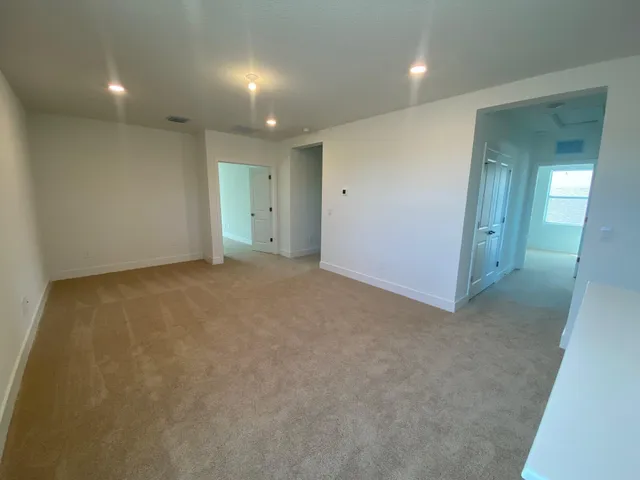 an empty room with a bathroom