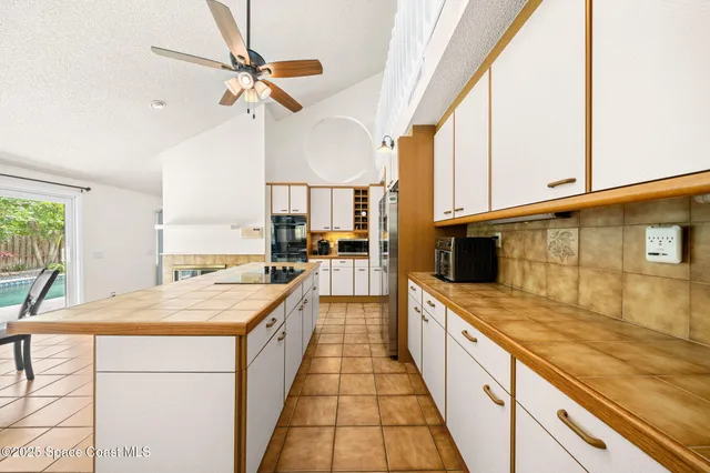 a kitchen with stainless steel appliances a sink and a stove