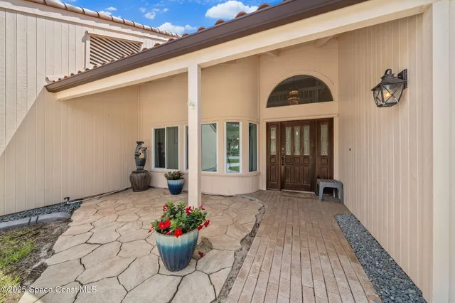 a front view of a house with outdoor seating