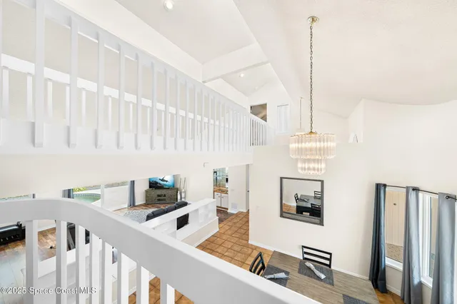 a kitchen with stainless steel appliances granite countertop a sink a stove and a wooden floor