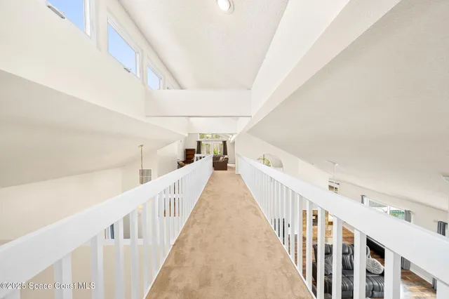 a view of a hallway with stairs