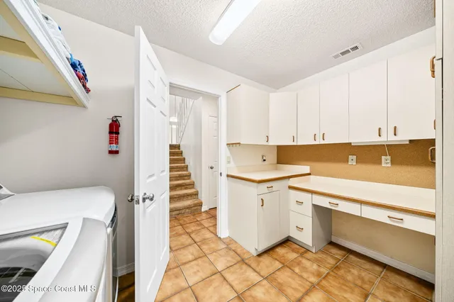 a view of a kitchen with storage and utility