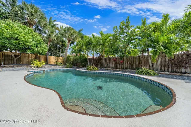 a view of a swimming pool with a sitting area
