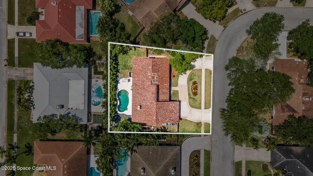 an aerial view of house with a yard