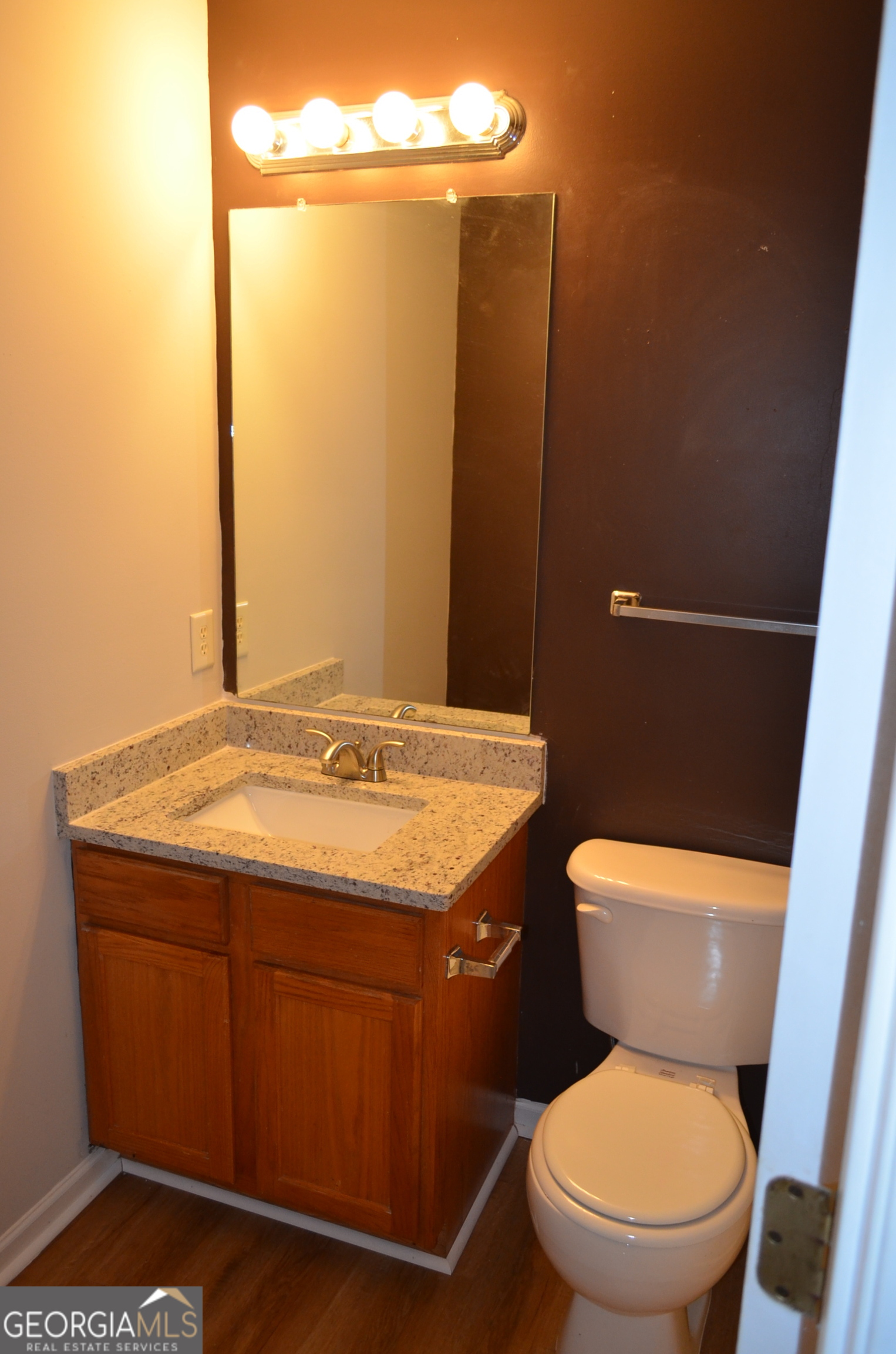 2722 Norfair Loop Lithonia, GA 30038 - Photo 20 of 25 a bathroom with a granite countertop toilet and a sink