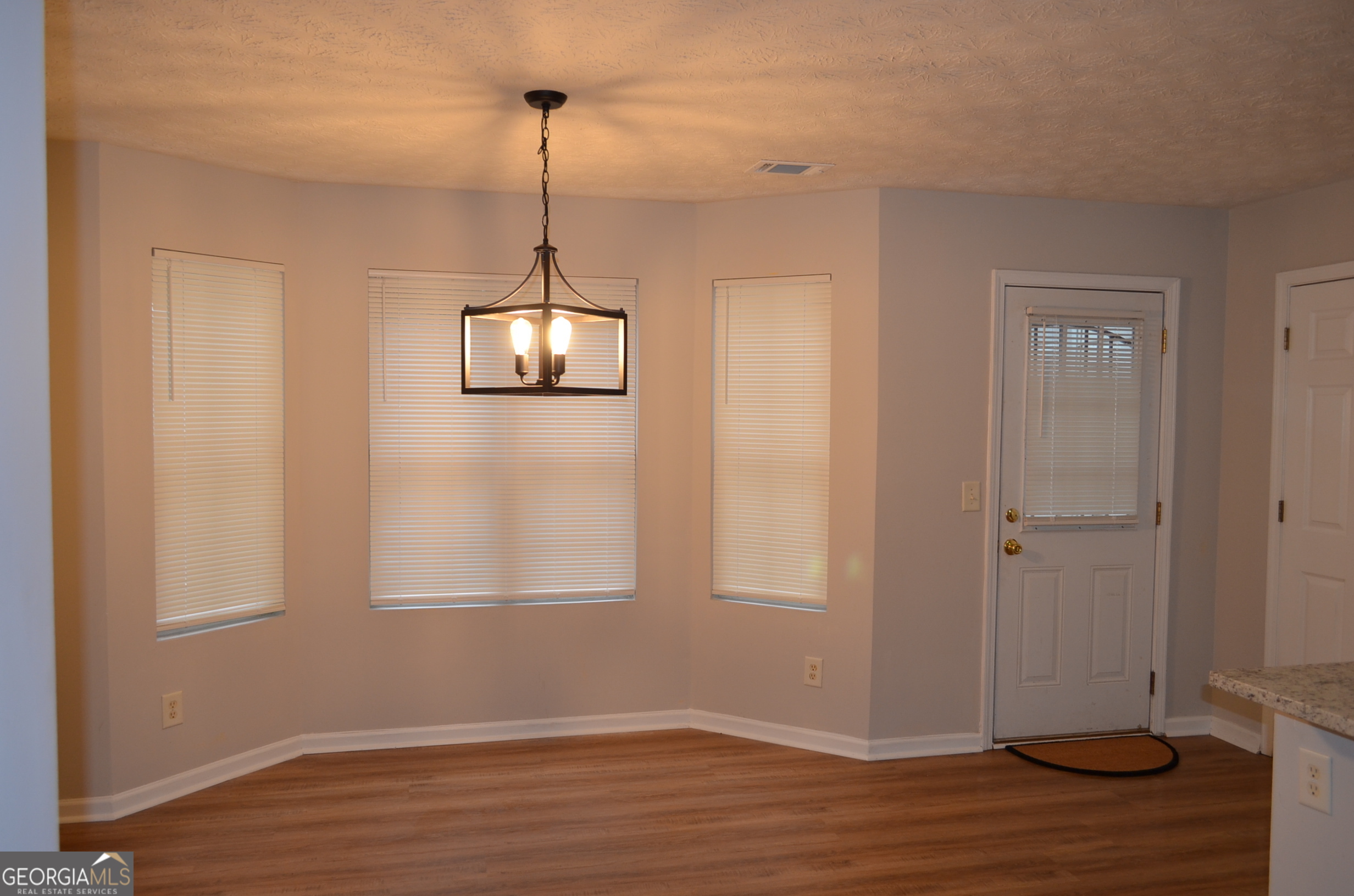 2722 Norfair Loop Lithonia, GA 30038 - Photo 7 of 25 a view of a room with wooden floor closet and windows
