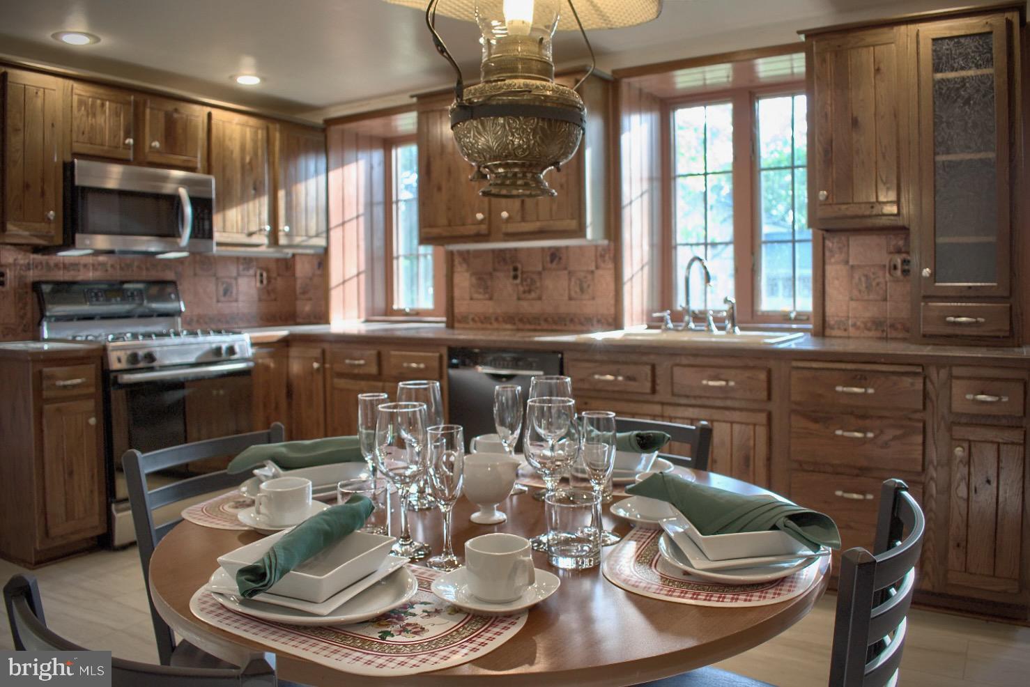 1025 Bloom Road Danville, PA 17821 - Photo 22 of 47 a kitchen with a stove a sink and a microwave