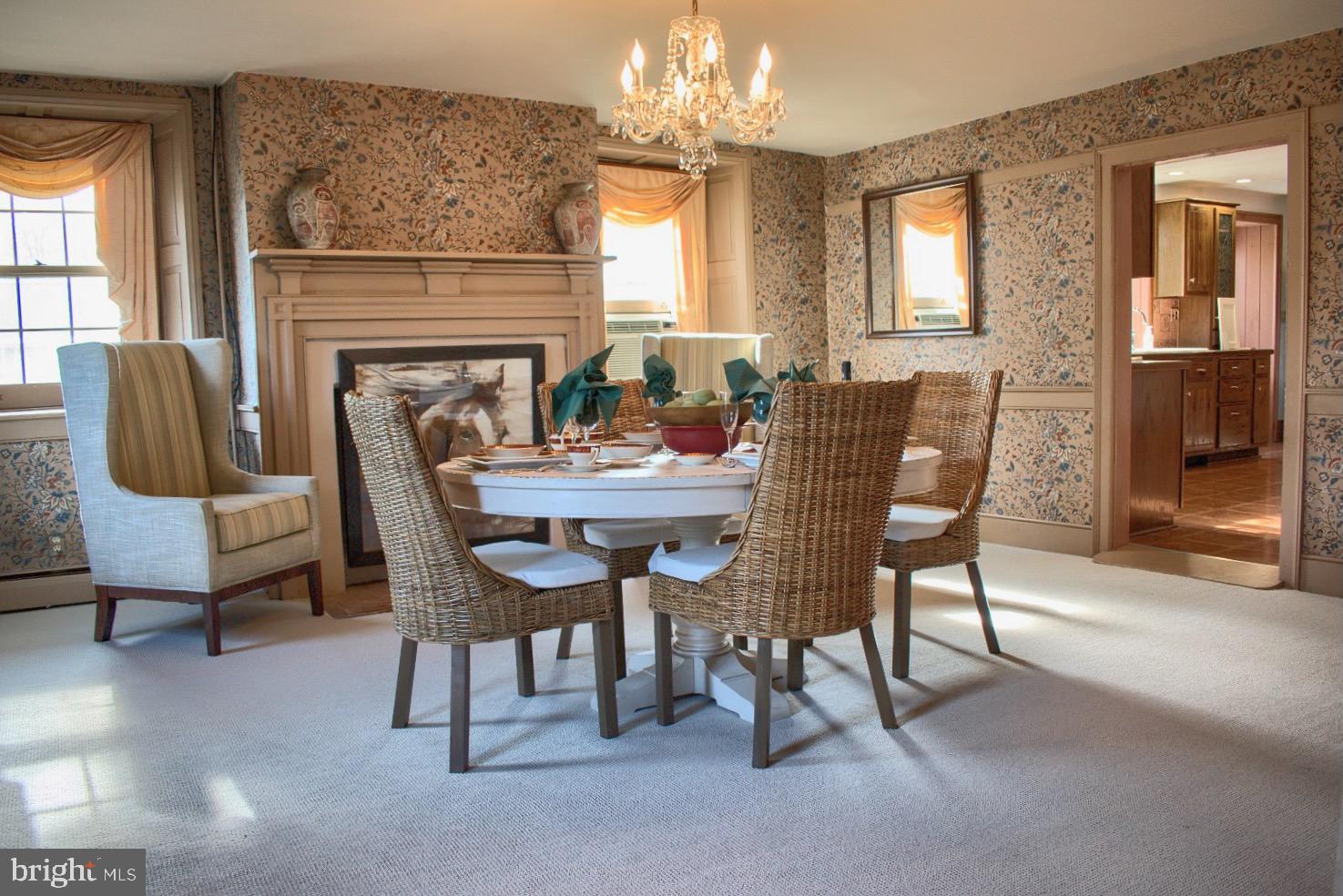 1025 Bloom Road Danville, PA 17821 - Photo 27 of 47 a dining room with furniture a chandelier and fireplace