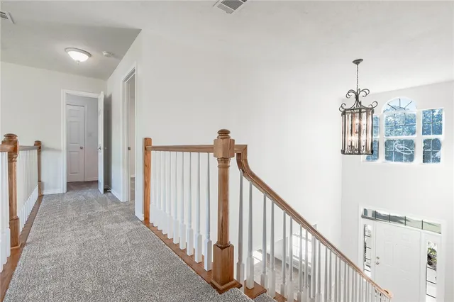 a view of a hallway with windows