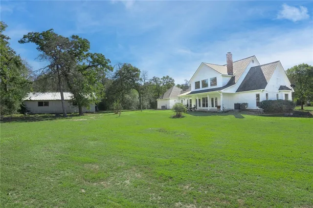 a view of a tiny house with a yard