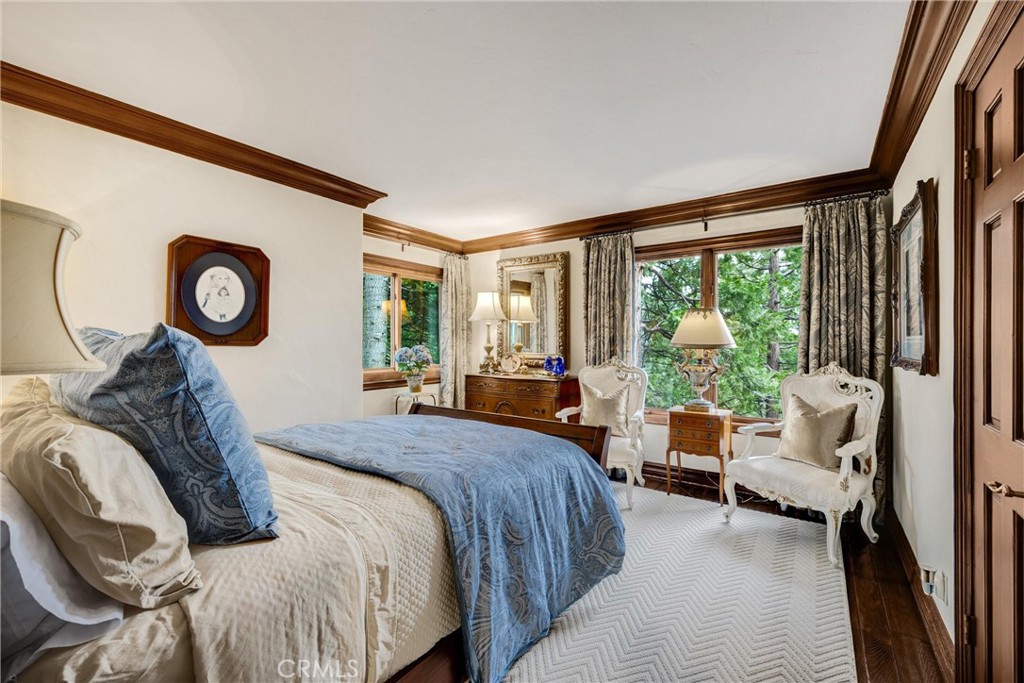 29162 Bald Eagle Ridge Road Lake Arrowhead, CA 92352 - Photo 15 of 69 a bedroom with a bed and a large window