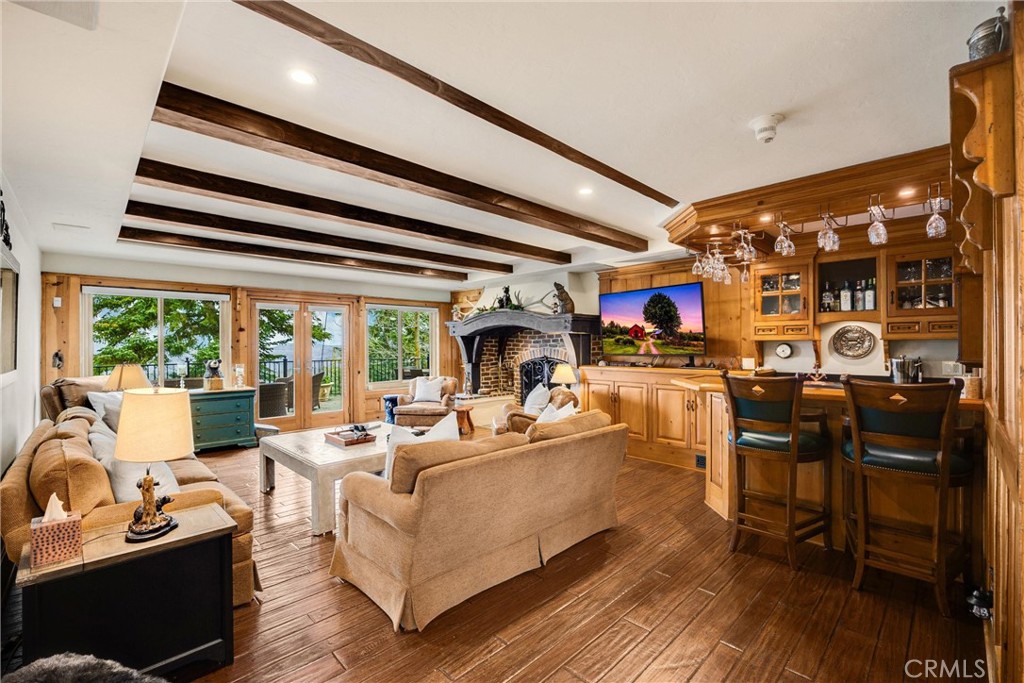 29162 Bald Eagle Ridge Road Lake Arrowhead, CA 92352 - Photo 17 of 69 a living room with fireplace furniture and a large window