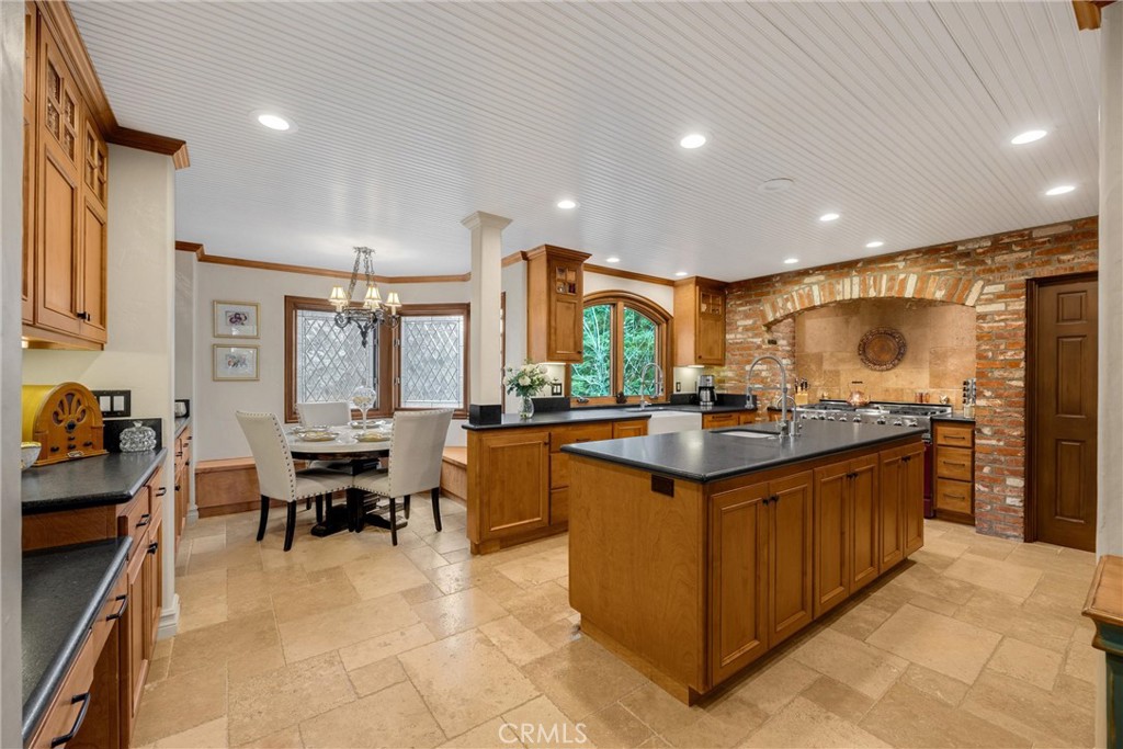 29162 Bald Eagle Ridge Road Lake Arrowhead, CA 92352 - Photo 19 of 69 a kitchen with kitchen island granite countertop a sink and counter space