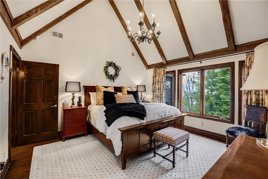 29162 Bald Eagle Ridge Road Lake Arrowhead, CA 92352 - Photo 31 of 69 a bedroom with bed and wooden floor